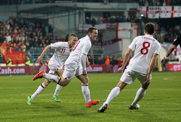 England s Wayne Rooney celebrates scoring his sides opening goal..Montenegro v England- World Cup Qualifier - Podgorica City Stadium, Podgorica- 26 03 13 - Picture David Klein Sportimage EDITORIAL USE ONLY. No use with unauthorised audio, video, data, fixture lists, club league logos or live services. Online in-match use limited to 120 images, no video emulation. No use in betting, games or single club league player publications.