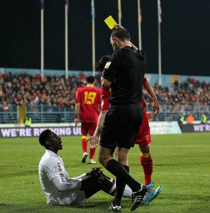 England s Danny Welbeck gets booked for diving..Montenegro v England- World Cup Qualifier - Podgorica City Stadium, Podgorica- 26 03 13 - Picture David Klein Sportimage EDITORIAL USE ONLY. No use with unauthorised audio, video, data, fixture lists, club league logos or live services. Online in-match use limited to 120 images, no video emulation. No use in betting, games or single club league player publications.