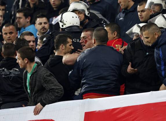 Montenegro s fans fight amongst themselves before kick-off..Montenegro - World Cup Qualifier - Podgorica City Stadium, Podgorica- 26 03 13 - Picture DavidKlein Sportimage EDITORIAL USE ONLY. No use with unauthorised audio, video, data, fixture lists, club league logos or live services. Online in-match use limited to 120 images, no video emulation. No use in betting, games or single club league player publications.