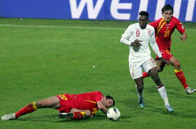 26.03.2013 Podgorica(Montenegro) Montenegro-England FIFA world cup Brazil qualifiers men football Danny Welbeck(c) England between Miodrag Dzudovic(L) and Stefan Savic(r) Montenegro :