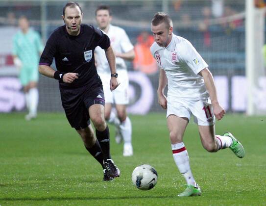 26.03.2013 Podgorica(Montenegro) Montenegro-England FIFA world cup Brazil qualifiers men football Tom Cleverley(r) England and Jonas Eroksson(L) Swedish referee :