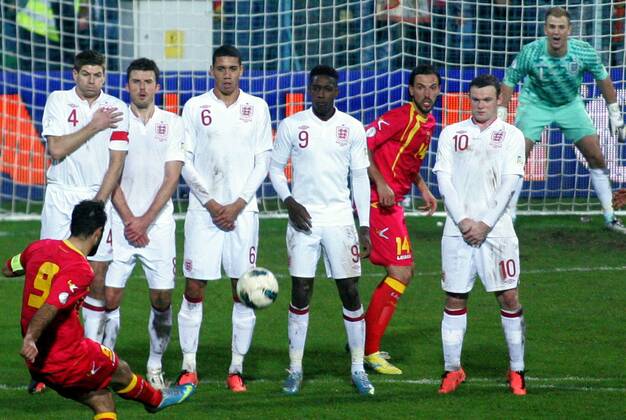 26.03.2013 Podgorica(Montenegro) Montenegro-England FIFA world cup Brazil qualifiers men football Mirko Vucinic (Left in font) Montenegro shoot across Steven Gerrard(L),Michael Carrick(2L),Chris Smalling(3L),Danny Welbeck(4L) with Wayne Rooney(r) England and Dejan Damjanovic(5L) Montenegro :