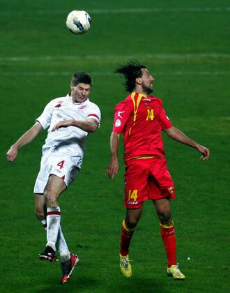 26.03.2013 Podgorica(Montenegro) Montenegro-England FIFA world cup Brazil qualifiers men football Steven Gerrard(L) England and Dejan Damjanovic(r) Montenegro :