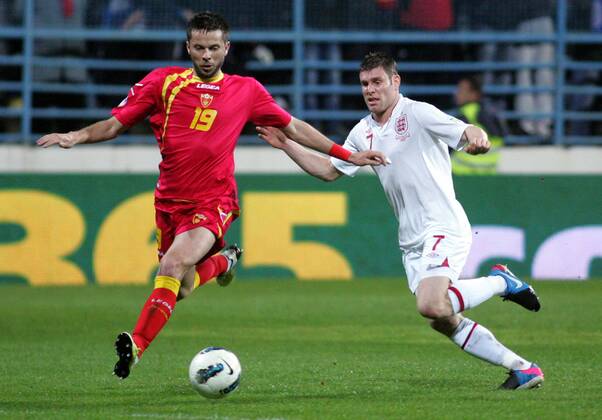 26.03.2013 Podgorica(Montenegro) Montenegro-England FIFA world cup Brazil qualifiers men football James Milner(r) England and Vladimir Bozovic(L) Montenegro :