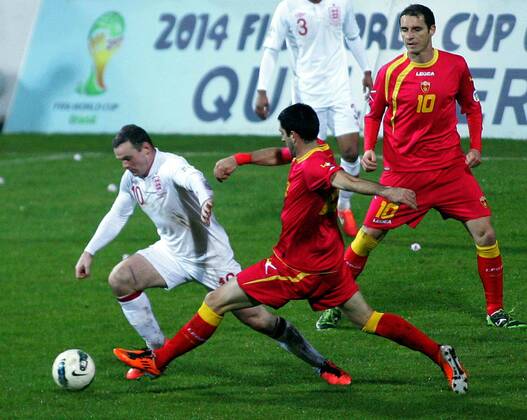 26.03.2013 Podgorica(Montenegro) Montenegro-England FIFA world cup Brazil qualifiers men football Wayne Rooney(L) England and Andrija Delibasic(R) Montenegro :