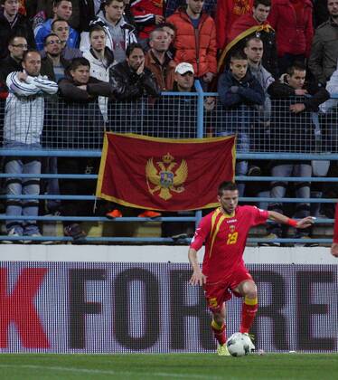 26.03.2013 Podgorica(Montenegro) Montenegro-England FIFA world cup Brazil qualifiers men football Vladimir Bozovic(down) and Montenegro fans on the fence :