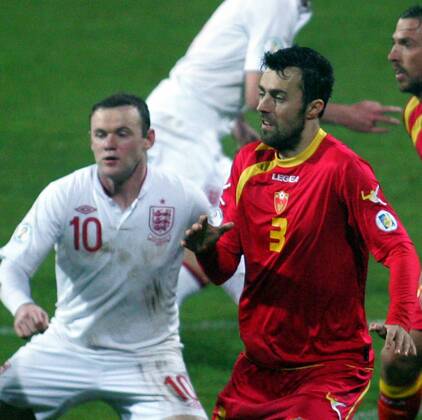 26.03.2013 Podgorica(Montenegro) Montenegro-England FIFA world cup Brazil qualifiers men football Wayne Rooney(L) England and Marko Basa(r) Montenegro :