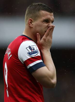 LONDON, April 13, 2013 - Lukas Podolski of Arsenal reacts during the Barclays Premier League match between Arsenal and Norwich City at the Emirates Stadium in London, Britain, on April 13, 2013. Arsenal won 3-1. (Xinhua Wang Lili)