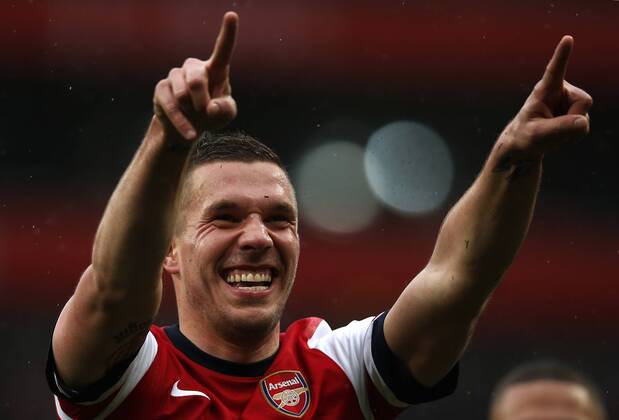 LONDON, April 13, 2013 - Lukas Podolski of Arsenal celebrates scoring during the Barclays Premier League match between Arsenal and Norwich City at the Emirates Stadium in London, Britain, on April 13, 2013. Arsenal won 3-1. (Xinhua Wang Lili)