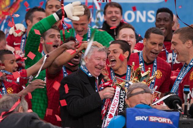 Football - Premier League 2012 2013 - Manchester United - Alex Ferguson, manager of Manchester United leads celebrations with the trophy at Old Trafford