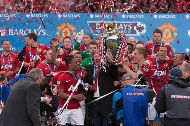 Football - Premier League 2012 2013 - Manchester United - Alex Ferguson, manager of Manchester United leads celebrations with the trophy at Old Trafford