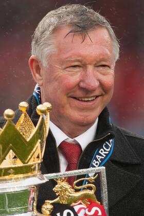 Football - Premier League 2012 2013 - Manchester United - Alex Ferguson, manager of Manchester United celebrates with the trophy at Old Trafford