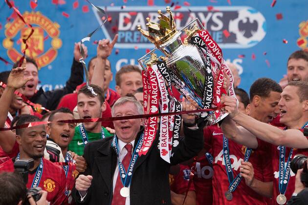 Football - Premier League 2012 2013 - Manchester United - Alex Ferguson, manager of Manchester United leads celebrations with the trophy at Old Trafford