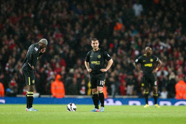 Football - 2012 2013 Premier League - Arsenal vs Wigan Wigan s Arouna Kone and Wigan s Shaun Maloney look dejected at the Emirates Stadium, London