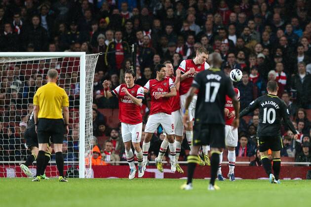 Football - 2012 2013 Premier League - Arsenal vs Wigan Wigan s Shaun Maloney scores a free kick at the Emirates Stadium, London