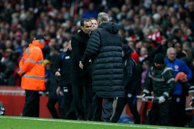Football - 2012 2013 Premier League - Arsenal vs Wigan Wigan manager Roberto Martinez and Manager of Arsenal Arsene Wenger shake hands after the game at the Emirates Stadium, London