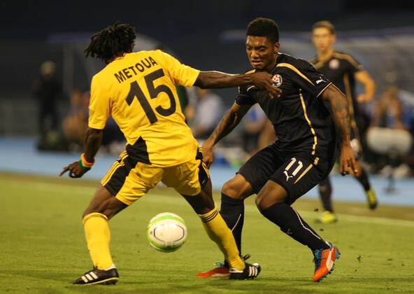 Zagreb, 30.7.2013. - UEFA Champions League 2013 2014, Third Qualifying Round, Stadium Maksimir. GNK Dinamo Zagreb (blue) - FC Sheriff Tiraspol (yellow). Junior Fernandes vs Kpamin Kouegbe Marcel Metoua GNK Dinamo - FC Sheriff