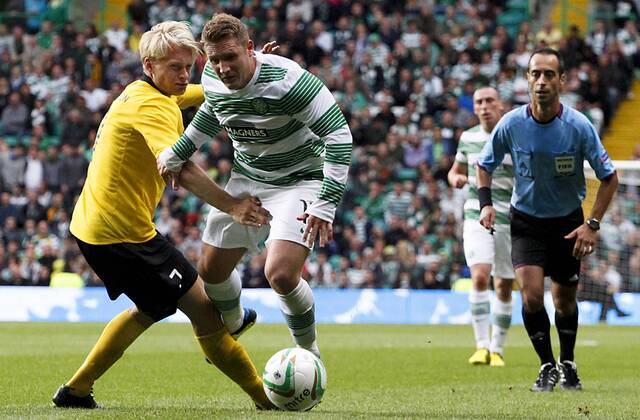 31.07.2013 Glasgow, Scotland. Kris Commons is brought down at the edge of the box by Johan Larsson during the UEFA Champions League Qualifying Third Round tie between Celtic Glasgow and IF Elsborg from Parkhead. xVagelisxGeorgarioux  ActionPlus11434342