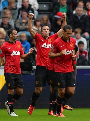 Robin van Persie of Manchester United celebrates scoring the first goal - Barclays Premier League - Swansea City AFC vs Manchester United - Liberty Stadium - Swansea - Wales - 17 08 13 - EDITORIAL USE ONLY. No use with unauthorised audio, video, data, fixture lists, club league logos or live services. Online in-match use limited to 120 images, no video emulation. No use in betting, games or single club league player publications.