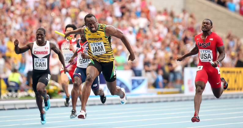 (130818) -- MOSCOW, Aug. 18, 2013 (Xinhua) --Usain Bolt of Jamaica(2nd,R) crosses the finish line druing the men s 4X100 Meters Relay final at the 14th IAAF World Athletics Championships 2013 in Moscow, Russia on Aug. 18, 2013. Team of Jamica won the gold with 37.36 seconds. (Xinhua Li Ming) (SP)RUSSIA-MOSCOW-ATHLETICS-IAAF WORLD CHAMPIONSHIPS 