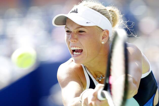 Caroline Wozniacki of Denmark hits a backhand in her straight sets victory in the first round match in day two at the U.S. Open Tennis Championships at the USTA BillieJeanKing National Tennis Center in New York City on August 27, 2013.  NYP20130827123