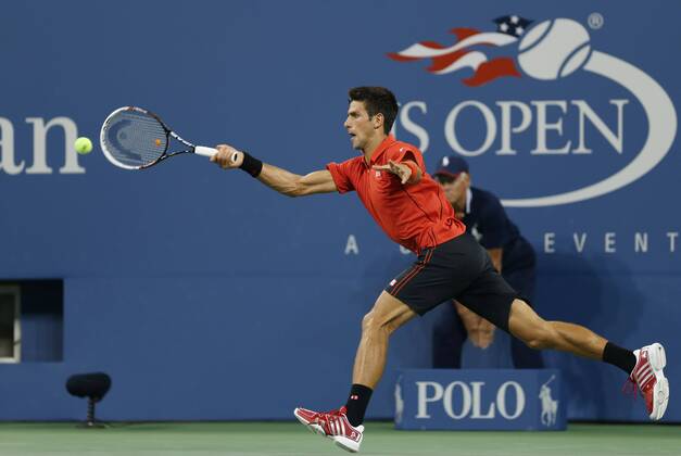 Novak Djokovic of Serbia returns a shot during the men s singles first round match at the U.S. Open tennis championships in New York, Aug. 27, 2013. (Xinhua Fang Zhe) (SP)U.S.-NEW YORK-TENNIS-U.S. OPEN-DJOKOVIC 