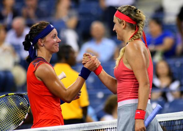 Dinah Pfizenmaier of Germany (L) and Victoria Azarenka of Belarus shake hands at the conclusion of their round-one match where Pfizenmaier lost in two sets at the U.S. Open Championship held at the USTA BillieJeanKing National Tennis Center on August 27, 2013 in New York City.  NYP20130827338
