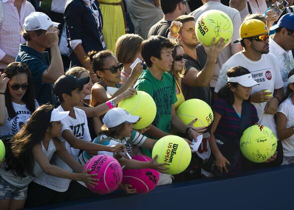 Aug. 27, 2013 - Flushing, Queens, New York, U.S - August 27, 2013: Young fans wait to have their tennis balls signed at court side on Day 2 of the 2013 U.S. Open Tennis Championships at the USTA BillieJeanKing National Tennis Center in Flushing, Queens, New York. TENNIS 2013: US OPEN Championship AUG 27 - ZUMAc04