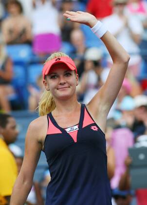 Agnieszka Radwanska of Poland waves to the crowd after defeating during round-two action at the U.S. Open Championship held at the USTA Billie Jean King National Tennis Center on August 28, 2013 in New York City.  NYP20130828307