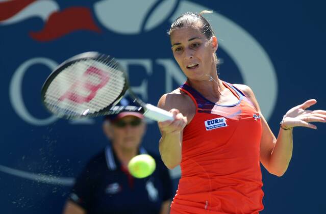 NEW YORK, Sept. 4, 2013 -- Flavia Pennetta of Italy returns a shot during her women s singles quarterfinal match during the U.S. Open tennis championships in New York, the United States, Sept. 4, 2013. 