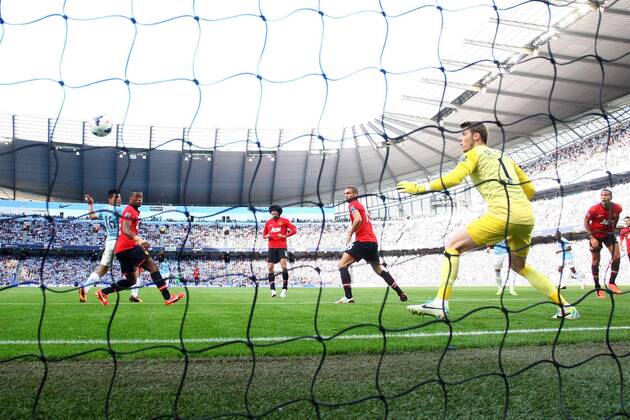 Sergio Kun Aguero of Manchester City scores the opening goal - Manchester City vs Manchester United - Barclay s Premier League - Etihad Stadium - Manchester - 22 09 2013 EDITORIAL USE ONLY. No use with unauthorised audio, video, data, fixture lists, club league logos or live services. Online in-match use limited to 120 images, no video emulation. No use in betting, games or single club league player publications.