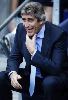 Manuel Pellegrini, manager of Manchester City, looks on ahead of the Barclays Premier League match between Manchester City and Manchester United at the Etihad Stadium(City of Manchester Stadium) in Manchester, Britain on September 22, 2013. Manchester City won 4-1. (Xinhua Wang Lili) FOR EDITORIAL USE ONLY. NOT FOR SALE FOR MARKETING OR ADVERTISING CAMPAIGNS. NO USE WITH UNAUTHORIZED AUDIO, VIDEO, DATA, FIXTURE LISTS, CLUB LEAGUE LOGOS OR LIVE SERVICES. ONLINE IN-MATCH USE LIMITED TO 45 IMAGES, NO VIDEO EMULATION. NO USE IN BETTING, GAMES OR SINGLE CLUB LEAGUE PLAYER PUBLICATIONS. (SP)BRITAIN-MANCHESTER-SOCCER-PREMIER LEAGUE-MAN CITY VS MAN UTD