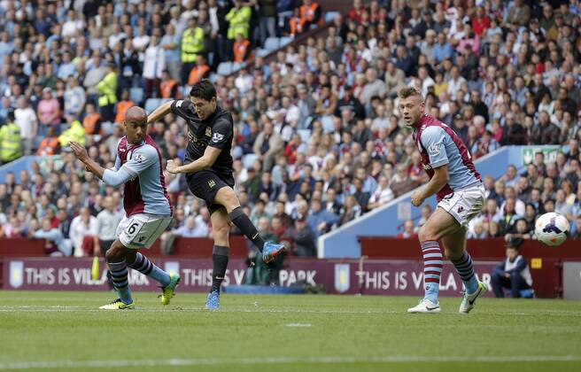 Samir Nasri of Manchester City gets between Fabian Delph and Nathan Baker to shoot narrowly wide of goal - Football - Barclays Premier League - Aston Villa vs Manchester City - Villa Park Birmingham - Season 2013-2014 - September 28th 2013 - Photograph Malcolm Couzens Sportimage EDITORIAL USE ONLY. No use with unauthorised audio, video, data, fixture lists, club league logos or live services. Online in-match use limited to 120 images, no video emulation. No use in betting, games or single club league player publications.