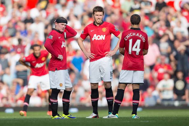 Wayne Rooney and Michael Carrick of Manchester United look dejected - Manchester United vs. West Bromwich Albion - Barclay s Premier League - Old Trafford - Manchester - 28 09 2013 Pic Philip Oldham Sportimage EDITORIAL USE ONLY. No use with unauthorised audio, video, data, fixture lists, club league logos or live services. Online in-match use limited to 120 images, no video emulation. No use in betting, games or single club league player publications.