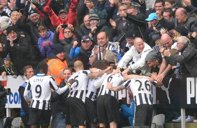 Loic Remy of Newcastle United celebrates with the fans following the second goal - Barclays Premier League - Newcastle Utd vs Chelsea - St James Park Stadium - Newcastle - England - 02 11 13 - Picture Simon Bellis Sportimage EDITORIAL USE ONLY. No use with unauthorised audio, video, data, fixture lists, club league logos or live services. Online in-match use limited to 120 images, no video emulation. No use in betting, games or single club league player publications.