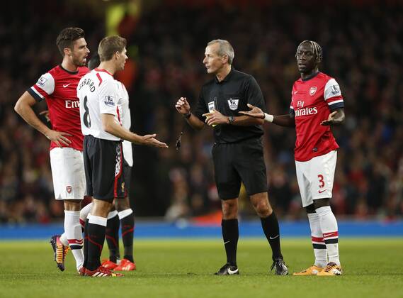 Arsenal s Bacary Sagna pleads his innocence as Liverpool s Steven Gerrard questions referee Martin Atkinson s decision not to play the advantage Arsenal v Liverpool - Barclays Premier League - Emirates Stadium - London - England -02 11 2013 - Pic David Klein Sportimage EDITORIAL USE ONLY. No use with unauthorised audio, video, data, fixture lists, club league logos or live services. Online in-match use limited to 120 images, no video emulation. No use in betting, games or single club league player publications.