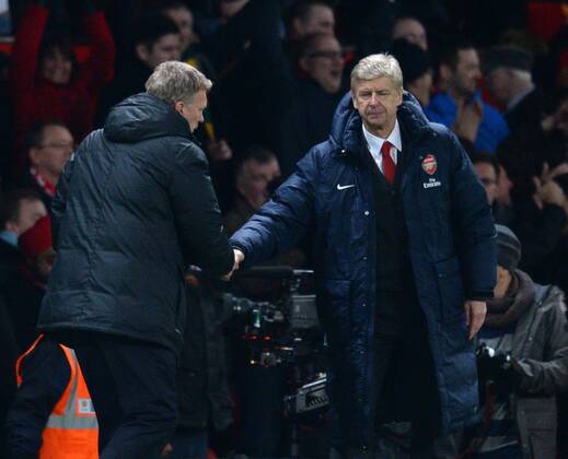 David Moyes manager of Manchester United shakes hands with Arsene Wenger manager of Arsenal at the end of the match - Barclays Premier League - Manchester United (ManU) vs Arsenal FC London - Old Trafford Stadium - Manchester - England - 10 11 13 - EDITORIAL USE ONLY. No use with unauthorised audio, video, data, fixture lists, club league logos or live services. Online in-match use limited to 120 images, no video emulation. No use in betting, games or single club league player publications.