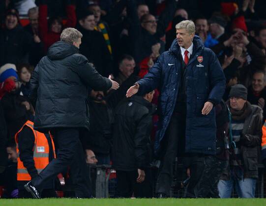 David Moyes manager of Manchester United shakes hands with Arsene Wenger manager of Arsenal at the end of the match - Barclays Premier League - Manchester United (ManU) vs Arsenal FC London - Old Trafford Stadium - Manchester - England - 10 11 13 - EDITORIAL USE ONLY. No use with unauthorised audio, video, data, fixture lists, club league logos or live services. Online in-match use limited to 120 images, no video emulation. No use in betting, games or single club league player publications.