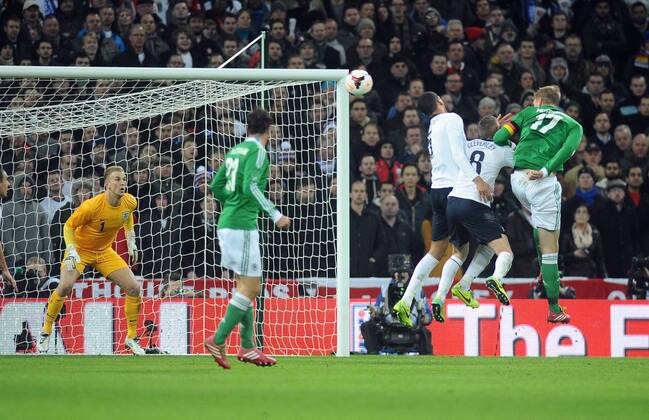 Football - 2013 International Friendly - England vs. Germany Per Mertesacker - Germany (17) heads his goal past Joe hart at Wembley. COLORSPORT ANDREW COWIE