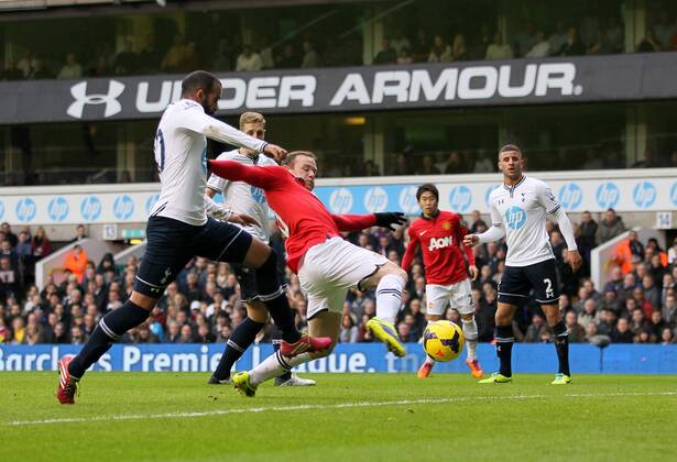 Manchester United s Wayne Rooney scoring his sides opening goal Tottenham Hotspur v Manchester United (ManU) - Premier League - White Hart Lane - London - 01 12 2013 - EDITORIAL USE ONLY. No use with unauthorised audio, video, data, fixture lists, club league logos or live services. Online in-match use limited to 120 images, no video emulation. No use in betting, games or single club league player publications.