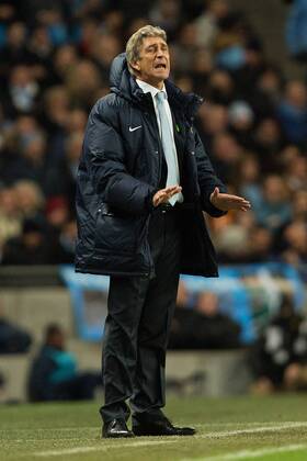 Manuel Pellegrini, manager of Manchester City reacts during the first half - Manchester City vs. Swansea City - Barclays Premier League - Etihad Stadium - Manchester - 01 12 2013 Pic Philip Oldham Sportimage EDITORIAL USE ONLY. No use with unauthorised audio, video, data, fixture lists, club league logos or live services. Online in-match use limited to 120 images, no video emulation. No use in betting, games or single club league player publications.