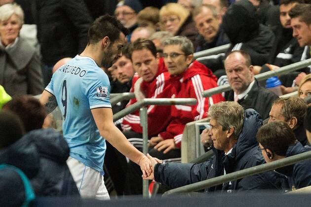 Manuel Pellegrini, manager of Manchester City thanks Alvaro Negredo following his substitution - Manchester City vs. Swansea City - Barclays Premier League - Etihad Stadium - Manchester - 01 12 2013 Pic Philip Oldham Sportimage EDITORIAL USE ONLY. No use with unauthorised audio, video, data, fixture lists, club league logos or live services. Online in-match use limited to 120 images, no video emulation. No use in betting, games or single club league player publications.