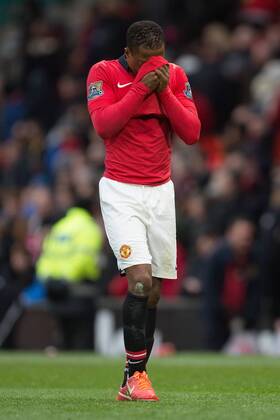 Patrice Evra of Manchester United looks dejected as he leaves the pitch following defeat - Manchester United vs. Newcastle United - Barclays Premier League - Old Trafford - Manchester - 04 12 2013 Pic Philip Oldham Sportimage EDITORIAL USE ONLY. No use with unauthorised audio, video, data, fixture lists, club league logos or live services. Online in-match use limited to 120 images, no video emulation. No use in betting, games or single club league player publications.