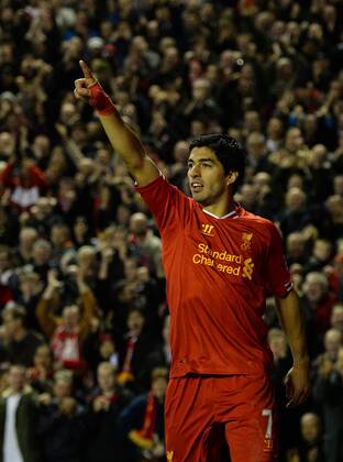 Luis Suarez of Liverpool celebrates the third goal - Barclays Premier League - Liverpool vs West Ham Utd - Anfield Stadium - Liverpool - England - 7th December 2013 - Picture Simon Bellis Sportimage EDITORIAL USE ONLY. No use with unauthorised audio, video, data, fixture lists, club league logos or live services. Online in-match use limited to 120 images, no video emulation. No use in betting, games or single club league player publications.