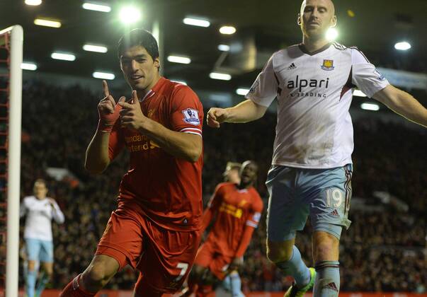 Luis Suarez of Liverpool celebrates the third goal - Barclays Premier League - Liverpool vs West Ham Utd - Anfield Stadium - Liverpool - England - 7th December 2013 - Picture Simon Bellis Sportimage EDITORIAL USE ONLY. No use with unauthorised audio, video, data, fixture lists, club league logos or live services. Online in-match use limited to 120 images, no video emulation. No use in betting, games or single club league player publications.