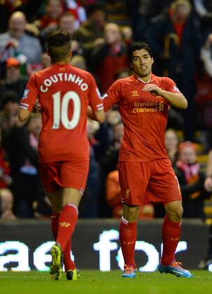 Luis Suarez of Liverpool celebrates the first goal with Coutinho - Barclays Premier League - FC Liverpool vs West Ham Utd - Anfield Stadium - Liverpool - England - 7th December 2013 - EDITORIAL USE ONLY. No use with unauthorised audio, video, data, fixture lists, club league logos or live services. Online in-match use limited to 120 images, no video emulation. No use in betting, games or single club league player publications.