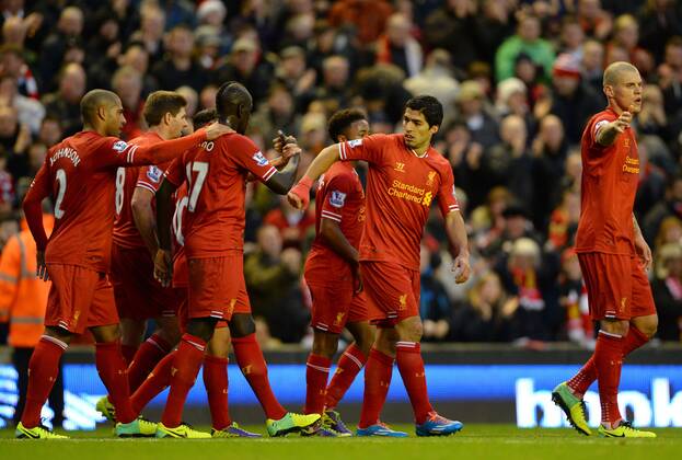 Luis Suarez of Liverpool celebrates the first goal - Barclays Premier League - FC Liverpool vs West Ham Utd - Anfield Stadium - Liverpool - England - 7th December 2013 - EDITORIAL USE ONLY. No use with unauthorised audio, video, data, fixture lists, club league logos or live services. Online in-match use limited to 120 images, no video emulation. No use in betting, games or single club league player publications.