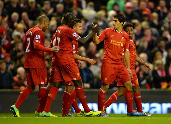 Luis Suarez of Liverpool celebrates the first goal - Barclays Premier League - FC Liverpool vs West Ham Utd - Anfield Stadium - Liverpool - England - 7th December 2013 - EDITORIAL USE ONLY. No use with unauthorised audio, video, data, fixture lists, club league logos or live services. Online in-match use limited to 120 images, no video emulation. No use in betting, games or single club league player publications.