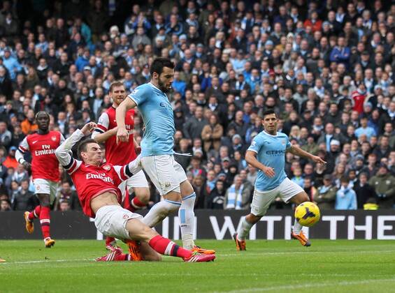Manchester City s Alvaro Negredo scoring his sides second goal Manchester City vs Arsenal - Premier League - Etihad Stadium - Manchester - England - 14 12 2013 - Pic David Klein Sportimage EDITORIAL USE ONLY. No use with unauthorised audio, video, data, fixture lists, club league logos or live services. Online in-match use limited to 120 images, no video emulation. No use in betting, games or single club league player publications.