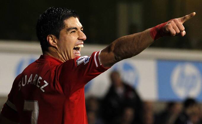Luis Suarez of Liverpool celebrates scoring their fourth goal during the Barclays Premier League match between Tottenham Hotspur and Liverpool at White Hart Lane in London, Britain on Dec. 15, 2013. Liverpool won 5-0. (Xinhua Wang Lili) FOR EDITORIAL USE ONLY. NOT FOR SALE FOR MARKETING OR ADVERTISING CAMPAIGNS. NO USE WITH UNAUTHORIZED AUDIO, VIDEO, DATA, FIXTURE LISTS, CLUB LEAGUE LOGOS OR LIVE SERVICES. ONLINE IN-MATCH USE LIMITED TO 45 IMAGES, NO VIDEO EMULATION. NO USE IN BETTING, GAMES OR SINGLE CLUB LEAGUE PLAYER PUBLICATIONS. (SP)BRITAIN-LONDON-SOCCER-PREMIER LEAGUE-TOTTENHAM HOTSPUR VS LIVERPOOL